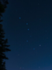 Fototapeta na wymiar The constellation of the Ursa Major in the night sky is blurred, a beautiful bokeh. 