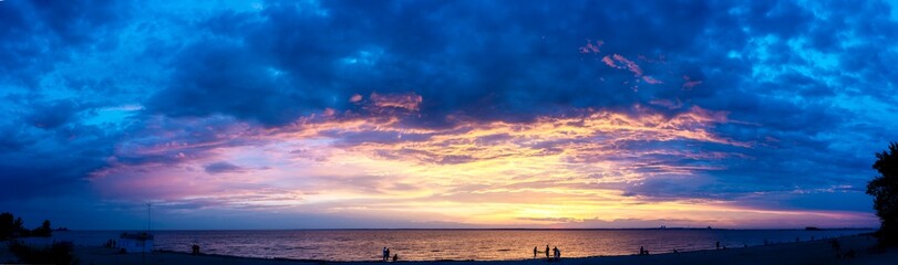 Beautiful sunset with colored clouds over the sea