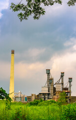 Fototapeta na wymiar Rice Mill in India with moody sky.