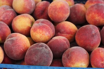 Juicy peaches on the market close up