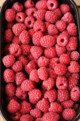 Delicious ripe raspberries on the market macro 