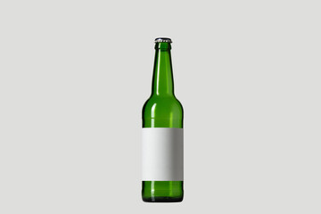 Empty green colored beer bottle. One object isolated on white studio background. Concept of beer, beverage, entertainment and alcohol. Copyspace for your bar, restaurant, brewery or shop advertising.