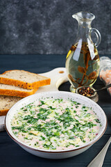 Russian traditional cold soup okroshka. Summer cold soup with yogurt and vegetables.