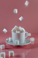 Sugar on a pink background. Art photo. Minimalism.
