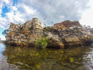Large canyon with a small river running across the rocks at Serra da Canastra region in Brazil.