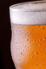 Glass of ice cold light beer