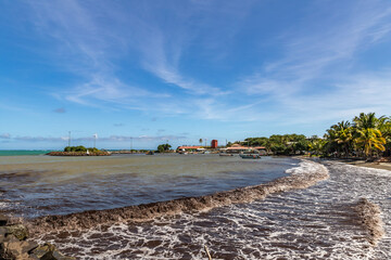 Shore line and  muddy ocean water in Vauclin, Martinique, France