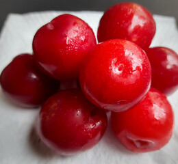 Colorful Red plums placed in white background and reduce the risk of cancer heart disease and diabetes
