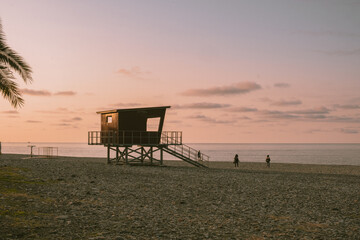 lifeguard tower at sunset