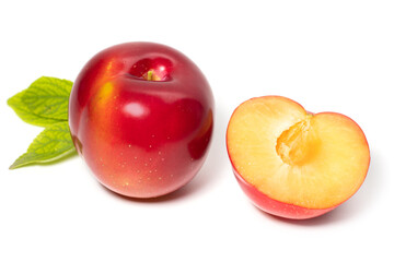 Plum fruit with plum leaf isolated on a white background