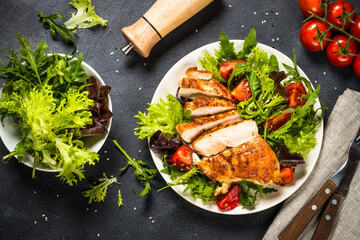 Grilled chicken with fresh salad at black.