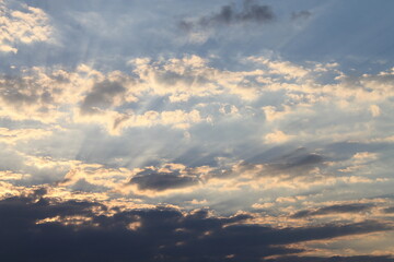 Fototapeta na wymiar Sun Shining in the Clouds
