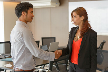 Fototapeta premium Multi ethnic business people shaking hands at the office