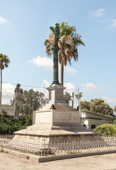 Obraz premium The statue of the Virgin Mary with a baby in her arms stands on a high pedestal opposite the Stella Maris Monastery which is located on Mount Carmel in Haifa city in northern Israel