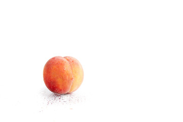 One peach isolated on white background