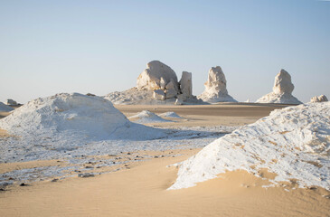 white desert with sand and lime stone rock formations. Bahariya national park Egypt. Surreal nature landscape. Scenic travel destinations africa. 