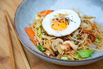 Yakisoba noddles with vegetables, seafood and egg