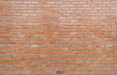 Large brick wall of red color, wide panorama.