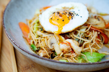 Yakisoba noddles with vegetables, seafood and egg