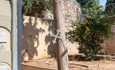 A skewed iron cross is nailed to a tree in the Teresas Church of the Holy which is located on Mount Carmel in Haifa city in northern Israel
