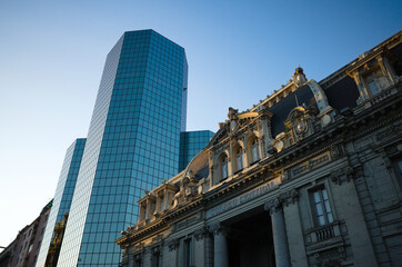 View from low angle view of building of National Historical Museum and new business office skyscraper in city cent re near Plaza de Armas square of Santiago, Chile. 