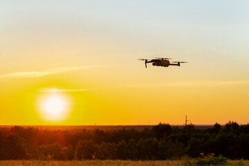 Fototapeta na wymiar Drone flying on sky background