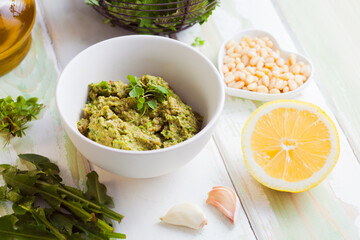 Wild herbs pesto close up in the bowl