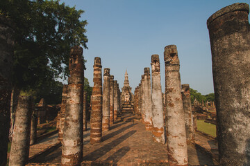 Fototapeta premium Ancient history Within the Sukhothai Historical Park In the orange sky in the evening Sukhothai, Thailand