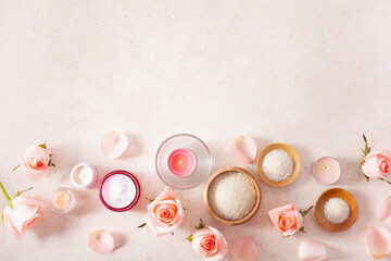 skincare products and rose flowers. natural cosmetics for home spa treatment