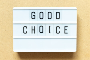 Lightbox with word good choice on wood background