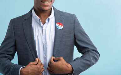 African american businessman with I Voted Today button on suit