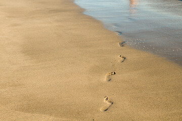 Fototapeta na wymiar Steps on the sand