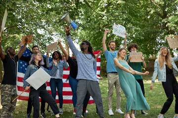 protest concerning marijuana, cannabis legalization in the streets. happy american activists with posters during manifestation