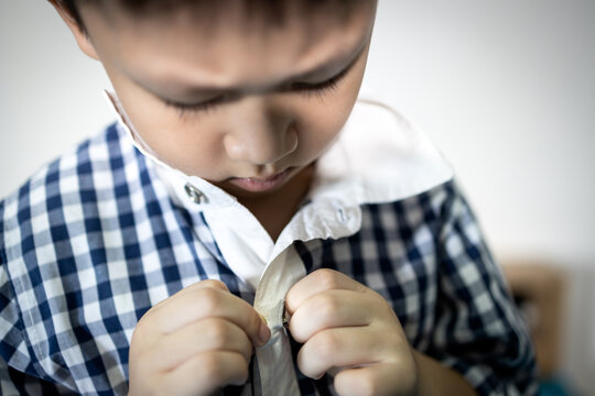 Little Child Is Trying To Wear Shirt,student Button Or Unbutton His Shirt At Home,kid Boy Kindergarten Self Study Learning To Change Clothes Dressing Before Back To School,lifestyle,skills,development