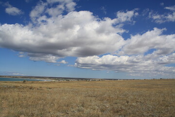 Blue sky and clouds over the steppes of the Crimea in the summer.