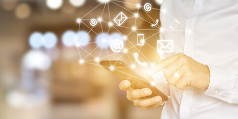 CONTACT US. Businessman hand using mobile smartphone with (phone, mail, address) icon.