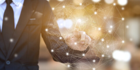 Businessman hands touching point network connection on blurred background. Wireless connect futuristic concept. Elements of this image furnished by NASA