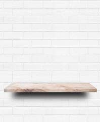 Empty wooden shelf on white brick wall background.