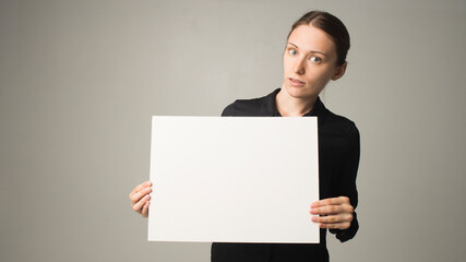 Girl holding white blank sign