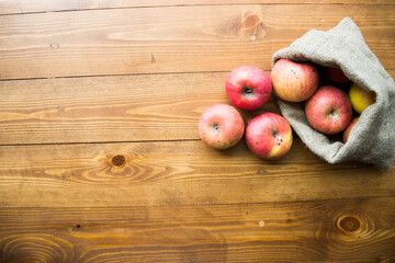 ripe apples on a wooden background