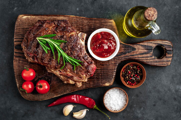 Marbled beef steak
grill
with spices on a stone background