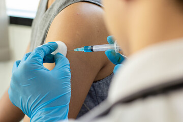 The doctor prepared a syringe to inject the patient with the underlying symptoms in the hospital.