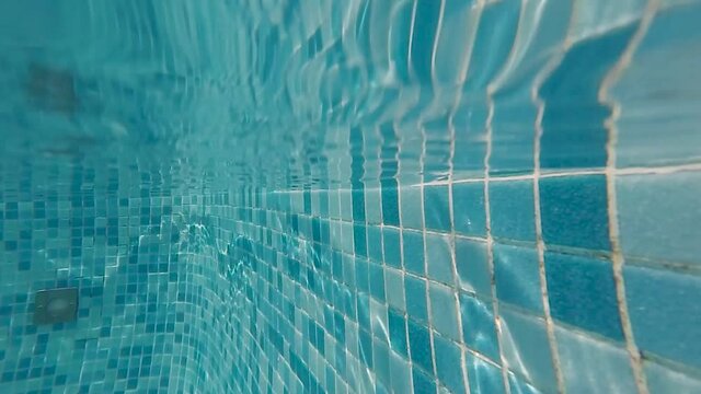 slow motion shot of a pool on the water line