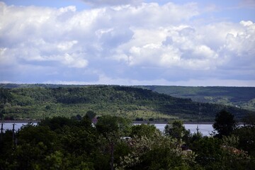 Beautiful summer landscape with hills and high forests