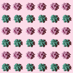 Seamless regular creative pattern with shiny bow from bright ribbon with dark shadow on pink paper. Printing on fabric, wrapping paper.