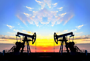 Oil drilling derricks at desert oilfield for fossil fuels output and crude oil production from the...