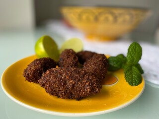Arabian food. Kibe. Meal. Yellow plate