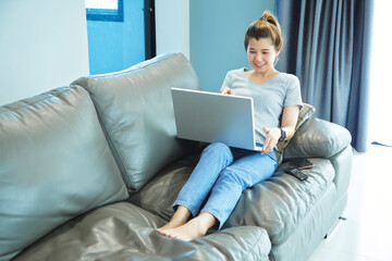 woman asian using laptop at home