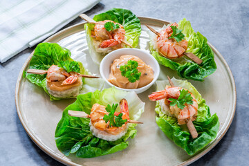Canapes with grilled black tiger prawns and seafood sauce