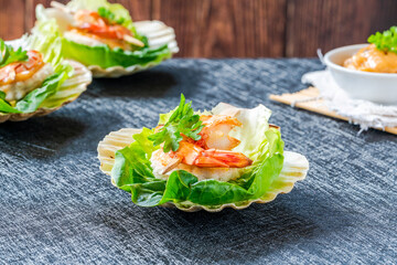 Canapes with grilled black tiger prawns and seafood sauce